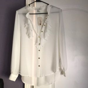 White blouse with gold buttons